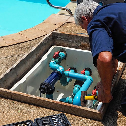 pool professional performing pool maintenance